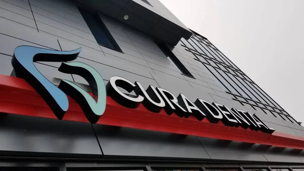 Cura Dental - Professional dental clinic exterior with modern facilities