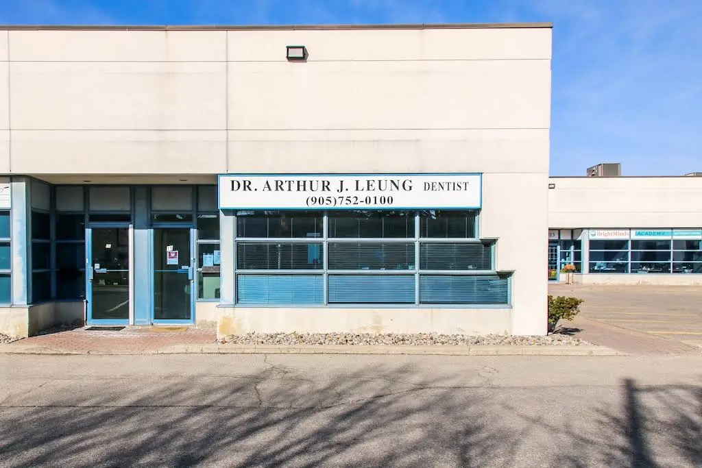 Dr. Arthur Leung & Dr. Brandon Lum - Professional dental clinic exterior with modern facilities