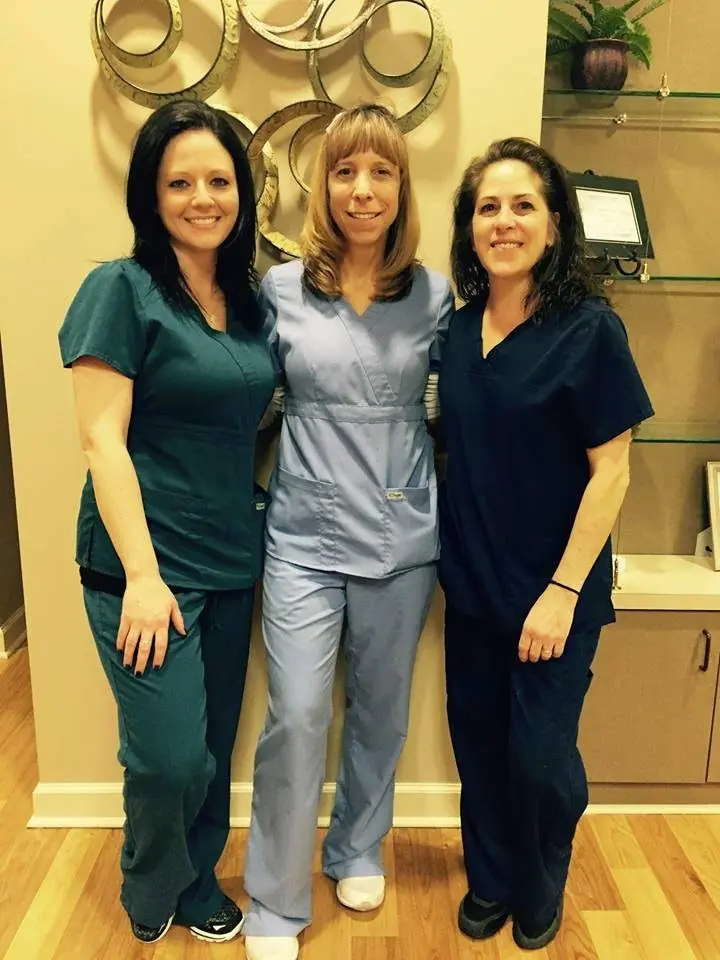Dental Designs by Drs. Newman, Tam, and Assoc.
