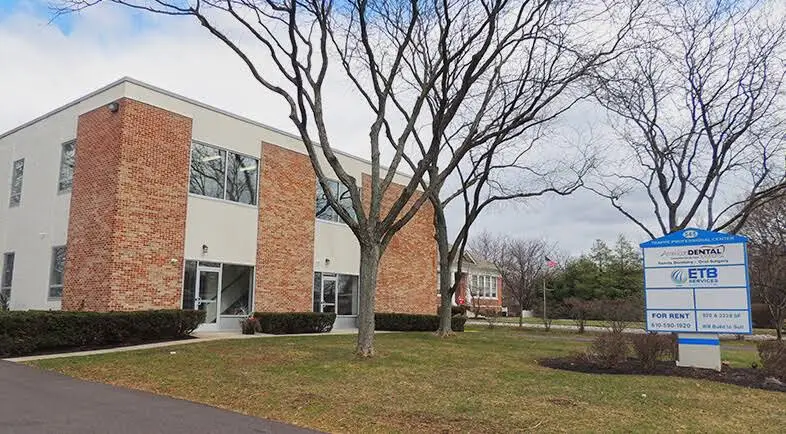 American Dental Solutions - Professional dental clinic exterior with modern facilities