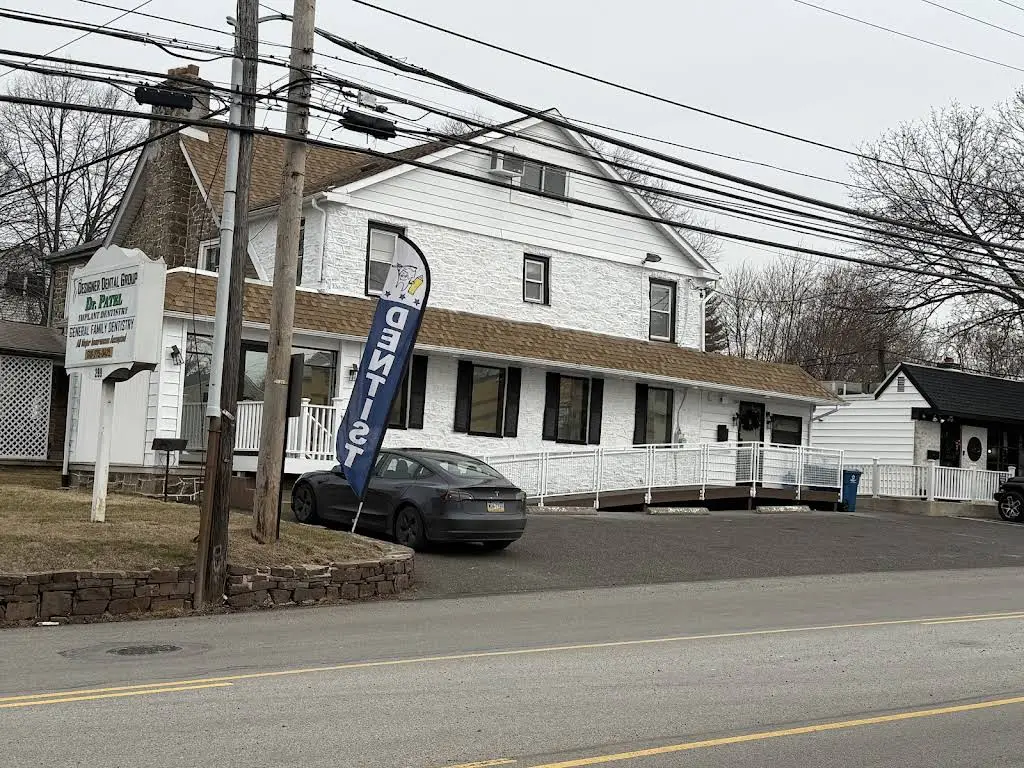 Designer Dental Group - All On 4 Implant Center - Professional dental clinic exterior with modern facilities