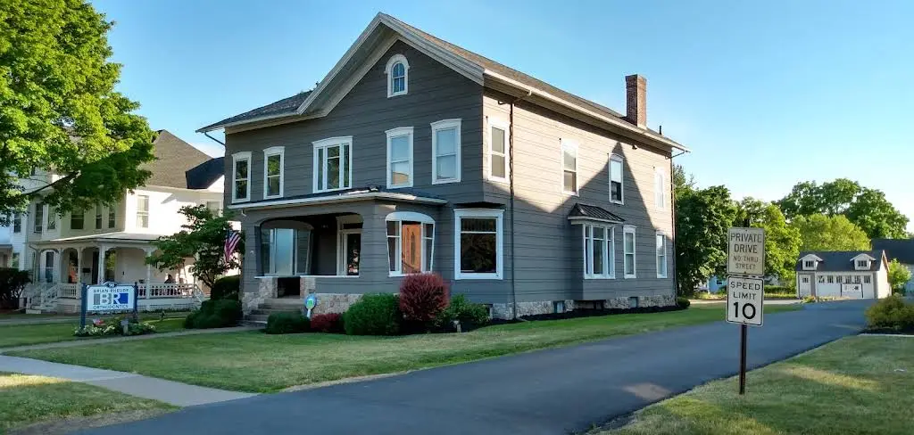 Brian Rheude Orthodontics - Professional dental clinic exterior with modern facilities