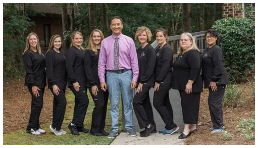 Progressive Family Dentistry: Dr. John M. Corella, DMD - Professional dental clinic exterior with modern facilities