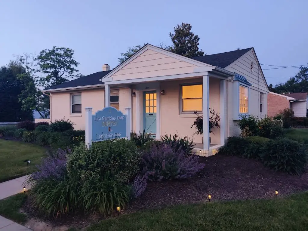 Dr. Lisa Gambino, DMD - Professional dental clinic exterior with modern facilities