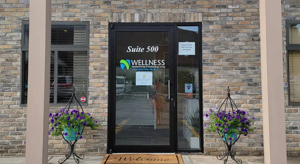 Wellness Periodontology & Implantology Group - Professional dental clinic exterior with modern facilities