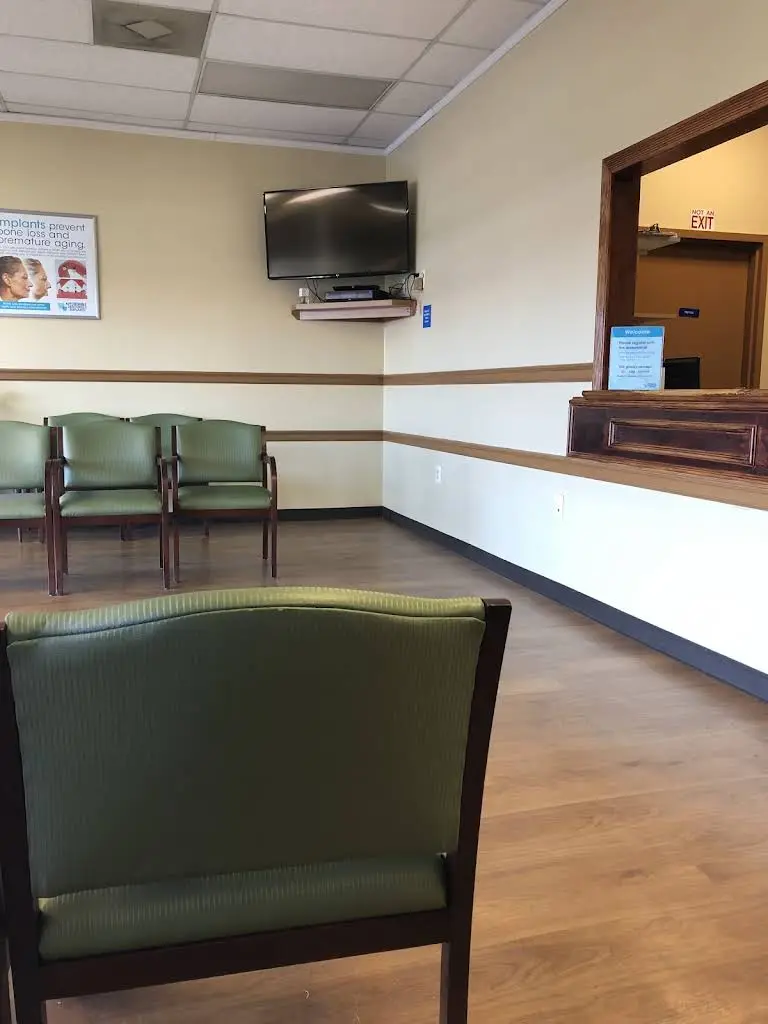 Affordable Dentures & Implants - Professional dental clinic exterior with modern facilities