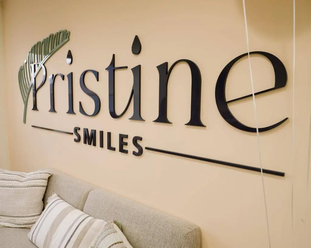 Pristine Smiles - Professional dental clinic exterior with modern facilities
