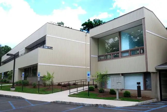 Gallery of Smiles - Professional dental clinic exterior with modern facilities