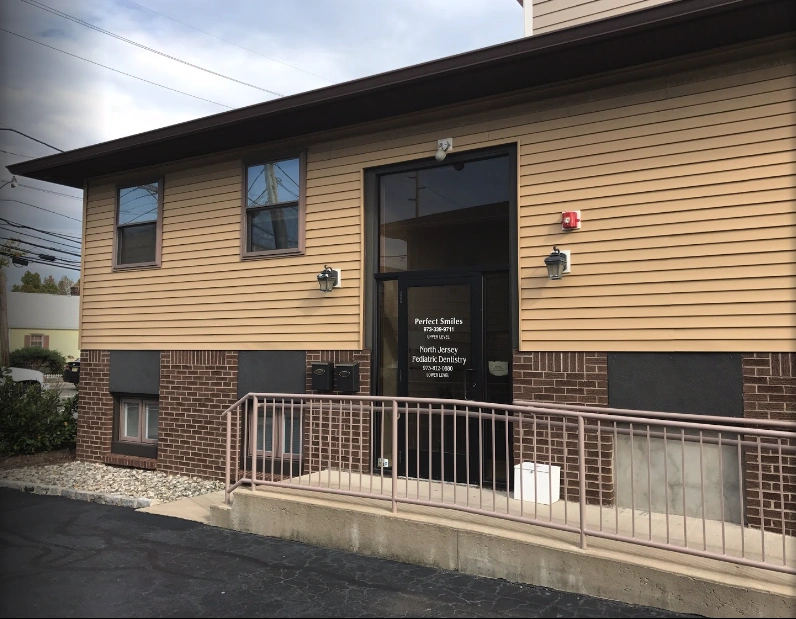 Perfect Smiles, LLC - Professional dental clinic exterior with modern facilities