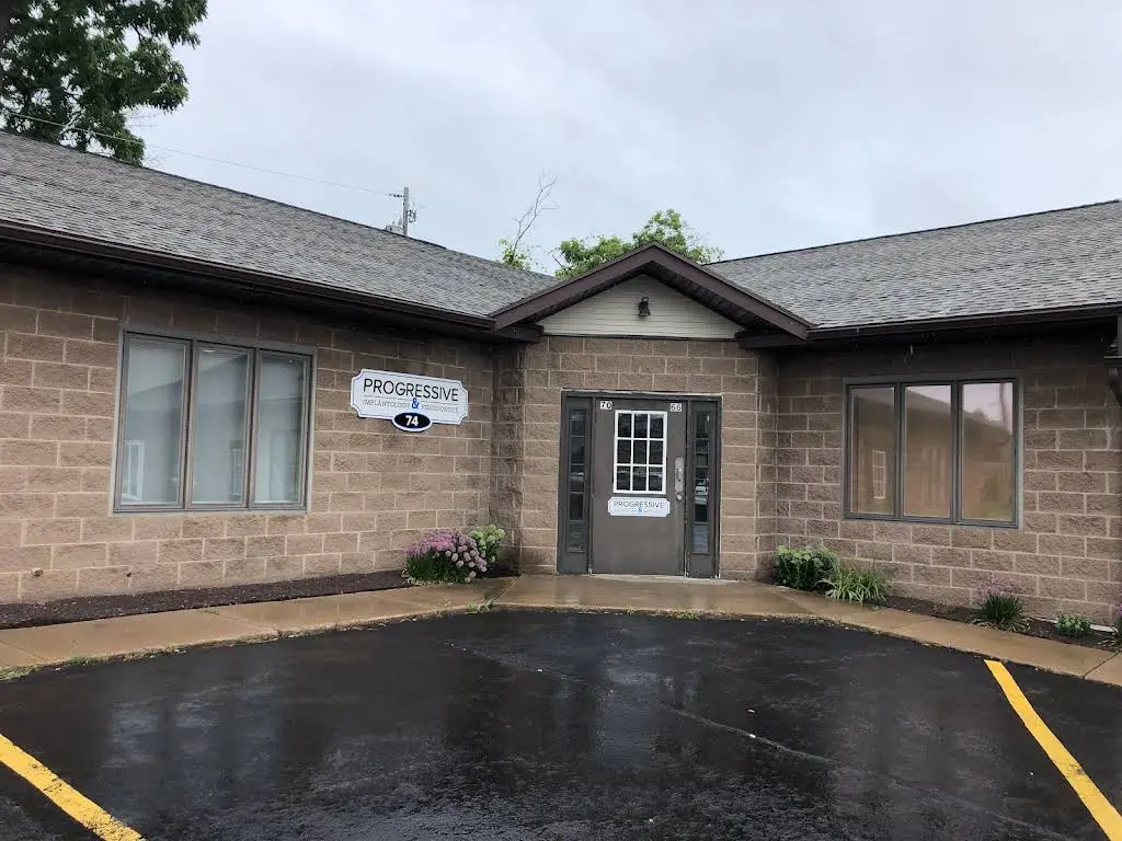 Progressive Implantology & Periodontics - Professional dental clinic exterior with modern facilities
