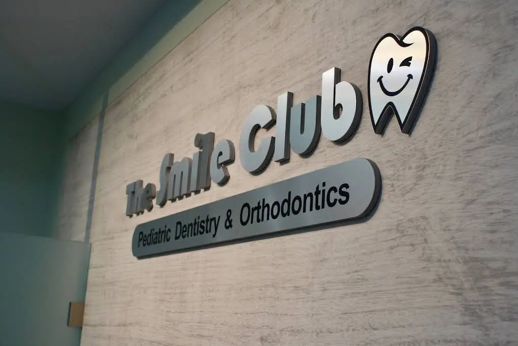 The Smile Club - Professional dental clinic exterior with modern facilities