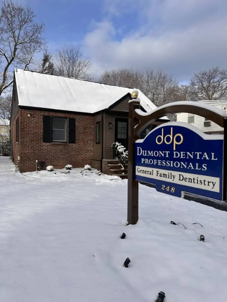 Dumont Dental Professionals - Professional dental clinic exterior with modern facilities