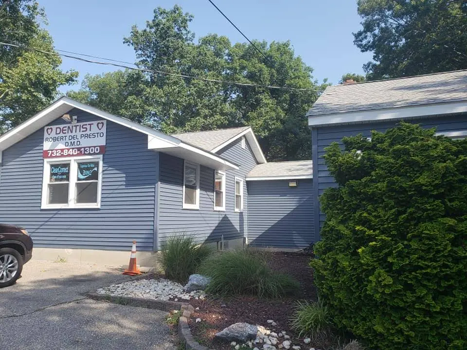 Smile Design - Professional dental clinic exterior with modern facilities