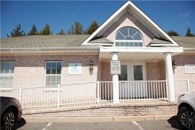Ocean Smiles - Professional dental clinic exterior with modern facilities