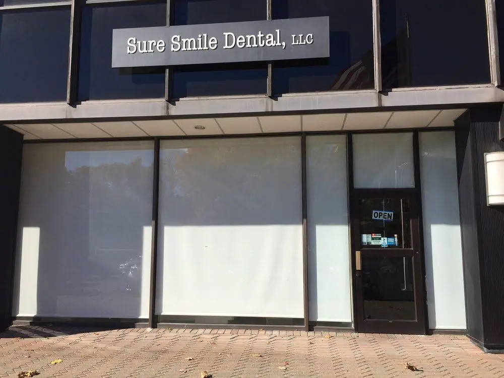 Sure Smile - Professional dental clinic exterior with modern facilities