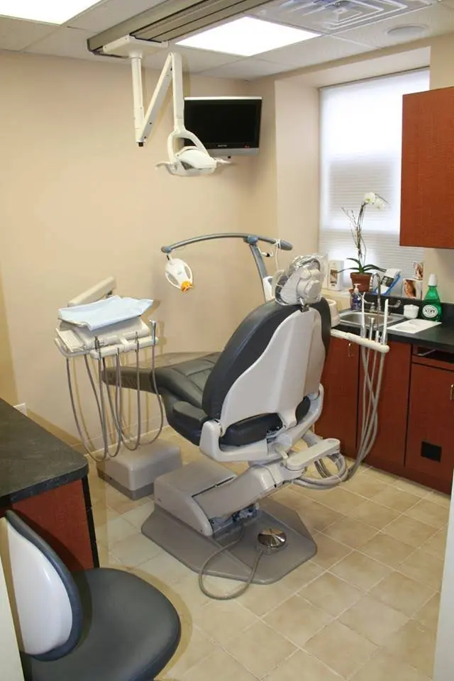 The Dental Design Center - Cosmetic, Implant & General Dentistry - Professional dental clinic exterior with modern facilities